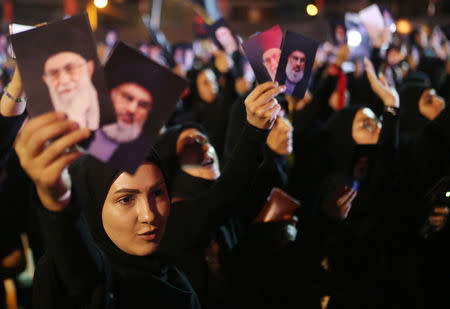 Female supporters of Lebanon's Hezbollah leader Sayyed Hassan Nasrallah chant slogans as he addresses his supporters via a screen the night before Muslim Shi'ites around the world mark the day of Ashura, in Beirut, Lebanon September 19, 2018. REUTERS/Hasan Shaaban