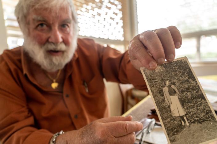 Werner Salinger, 90, a U.S. Air Force Intelligence veteran who enlisted during the Korean War, sorts through photographs and letters written by his wife, Martha Salinger, 89, at their home in Gold Canyon on January 13, 2023.

Werner, who survived the Holocaust with his family, met Martha during the height of the Cold War while deployed in Germany. Marthaâ€™s father, a government bureaucrat, was drafted into the German military during World War II.