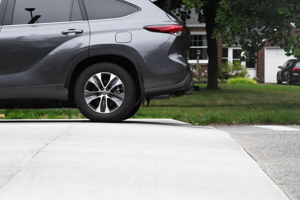 A car drives over a speed hump on East Madison Street in South Bend on Thursday July 20, 2023. The city is installing 94 speed humps in neighborhoods to calm traffic.