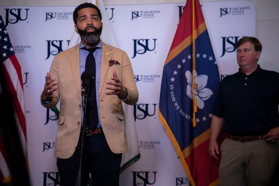 Mayor Chokwe Antar Lumumba, speaks while Gov. Tate Reeves listens during a press conference at the Jackson State University Student Center in Jackson, Miss., Wednesday, Sept. 7, 2022.