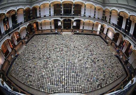 A general view of the installation "Stools" by Chinese artist Ai Weiwei pictured during a media preview of the 'Evidence' exhibition at the Martin-Gropius Bau in Berlin, April 2, 2014. REUTERS/Fabrizio Bensch