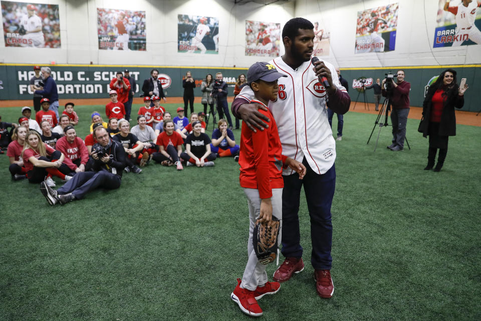 Cincinnati Reds Yasiel Puig takes questions from young athletes during a media availability at the P&G MLB Cincinnati Reds Youth Academy, Wednesday, Jan. 30, 2019, in Cincinnati. (AP Photo/John Minchillo)