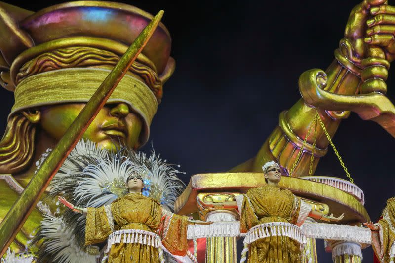 Revellers from Mancha Verde samba school perform during the first night of the Carnival parade at the Sambadrome in Sao Paulo