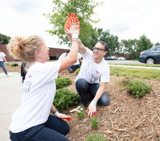 <p>Joel Plotkin</p> Bank of America teammates logged nearly two million volunteer hours throughout the year. Here, a few help with beautification activities at a Second Harvest event in Charlotte.