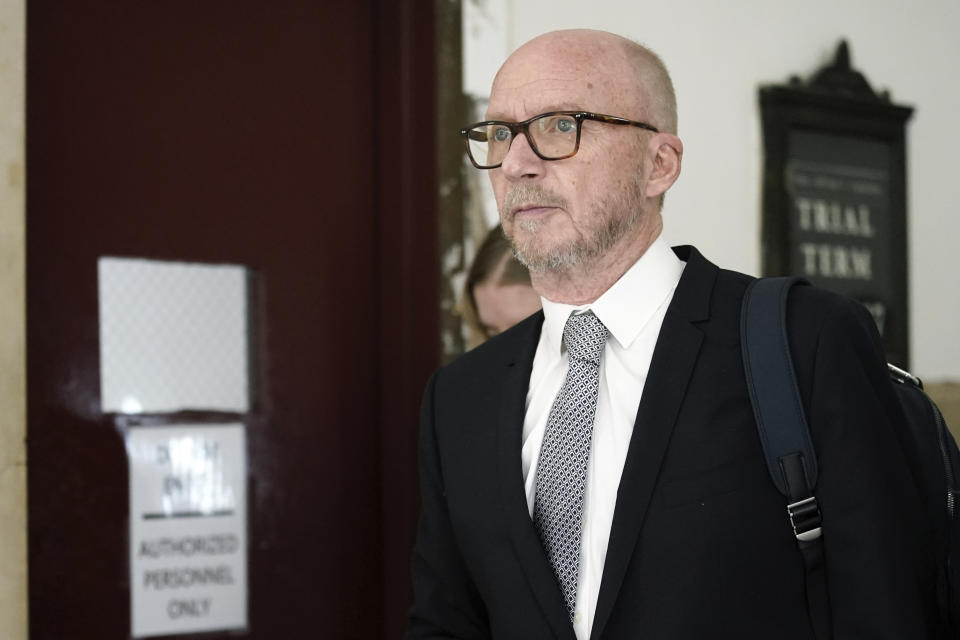 Film director Paul Haggis exits the courtroom for a lunch break, Wednesday, Oct. 19, 2022, in New York. Jurors are getting their first look at a lawsuit that pits Oscar-winning moviemaker Haggis against a publicist who alleges that he raped her. He says their 2013 encounter was consensual. (AP Photo/Julia Nikhinson)