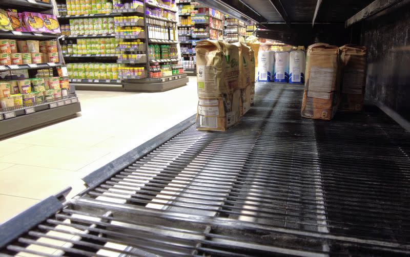 An almost empty supermarket shelf in Bonn