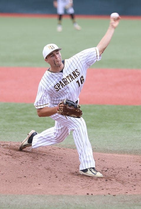 Roger Bacon senior Jake Tschida delivers a pitch against Reading in the DIII regional semifinal game June 2.