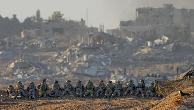 Israeli soldiers take positions near the Gaza Strip border, in southern Israel on Monday, Dec. 11, 2023. The army is battling Palestinian militants across Gaza in the war ignited by Hamas’ Oct. 7 attack into Israel.