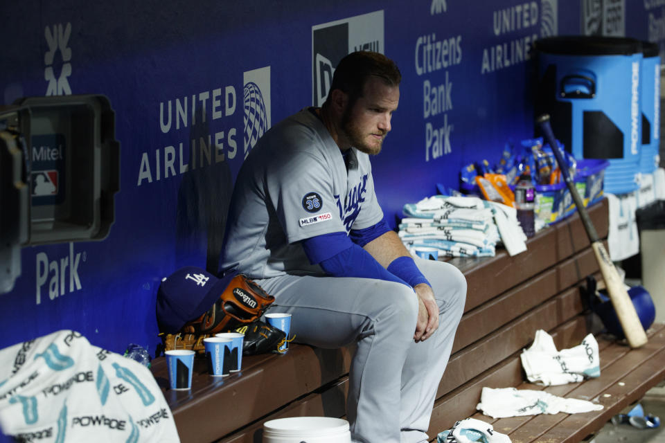 Los Angeles Dodgers' Max Muncy sits on the bench during a rain delay before the ninth inning of a baseball game against the Philadelphia Phillies, Tuesday, July 16, 2019, in Philadelphia. (AP Photo/Matt Slocum)