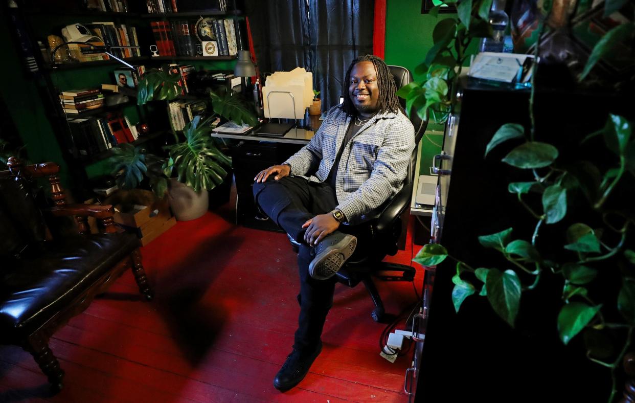 Imokhai Okolo, a local attorney and community organizer, poses for a portrait in his office at The Freedom BLOC in Akron.