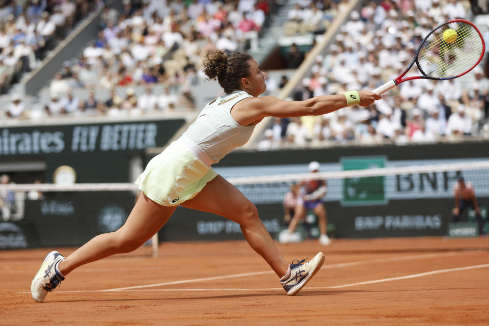 Italy's Jasmine Paolini plays a shot against Poland's Iga Swiatek during the women's final of the French Open tennis tournament at the Roland Garros stadium in Paris, France, Saturday, June 8, 2024. (AP Photo/Jean-Francois Badias)