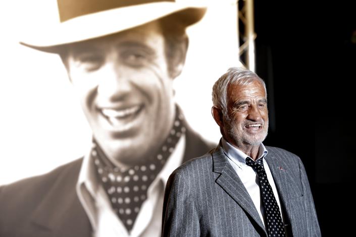 FILE - In this Oct. 14, 2013 file photo, French actor Jean-Paul Belmondo poses for photographers as he arrives at the opening ceremony of the 5th edition of the Lumiere Festival, in Lyon, central France. French New Wave actor Jean-Paul Belmondo has died, according to his lawyer’s office on Monday Sept. 6, 2021. (AP Photo/Laurent Cipriani, File)