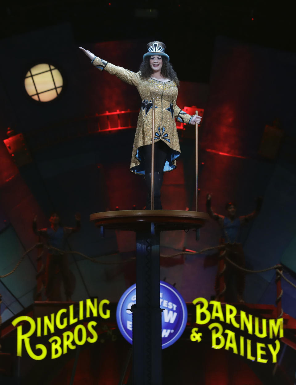 Ringling Bros. and Barnum & Bailey Ringmaster Kristen Michelle Wilson appears during a performance Saturday, Jan. 14, 2017, in Orlando, Fla. The Ringling Bros. and Barnum & Bailey Circus will end the "The Greatest Show on Earth" in May, following a 146-year run of performances. Kenneth Feld, the chairman and CEO of Feld Entertainment, which owns the circus, told The Associated Press, declining attendance combined with high operating costs are among the reasons for closing. (AP Photo/Chris O'Meara)
