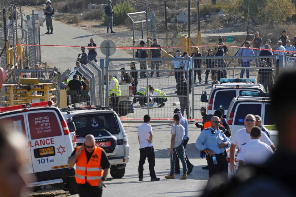 Attack: The scene at the entrance to the West Bank settlement: AFP/Getty Images