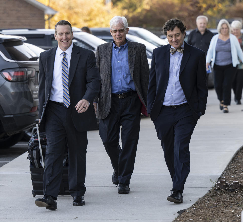 FILE - Thomas Martens, center, arrives with attorneys Jay Vannoy, left, and Jones Byrd at the Davidson County Courthouse, Oct. 30, 2023, in Lexington, N.C., for a hearing before his retrial in the murder of Jason Corbett. Martens and his daughter, Molly Corbett, were released from separate North Carolina prisons on Thursday, June 6, 2024, after completing the tail end of their sentences for pleas to voluntary manslaughter. (Walt Unks/The Winston-Salem Journal via AP, Pool, File)