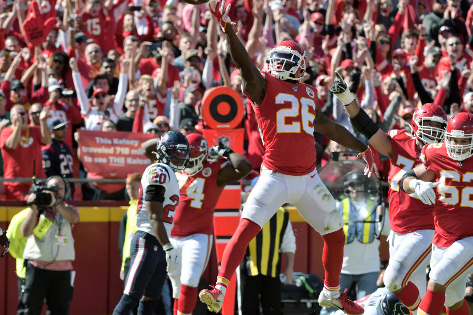 Kansas City Chiefs running back Damien Williams (26) celebrates a touchdown during the first half of an NFL football game against the Houston Texans in Kansas City, Mo., Sunday, Oct. 13, 2019. (AP Photo/Ed Zurga)