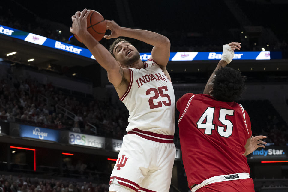 Indiana forward Race Thompson (25) grabs a rebound against Miami (Ohio) forward Anderson Mirambeaux (45) during the first half of an NCAA college basketball game, Sunday, Nov. 20, 2022, in Indianapolis. (AP Photo/Marc Lebryk)