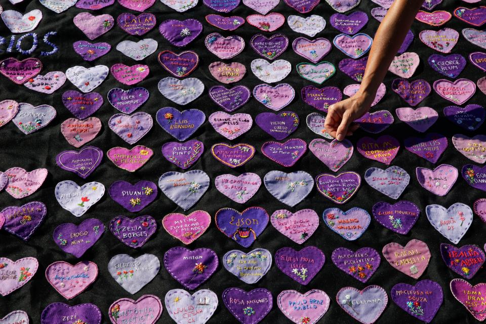 Hearts decorated with the names of Covid-19 victims outside Congress in Brasilia to protest the high death toll (AP)