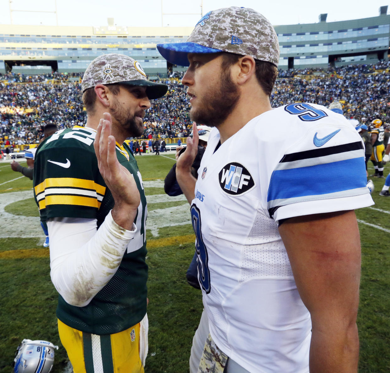 FILE - In this Nov. 15, 2015 file photo, Green Bay Packers' Aaron Rodgers talks to Detroit Lions' Matthew Stafford after an NFL football game in Green Bay, Wis.  Rodgers has been struggling a bit this season while Stafford is in one of his best grooves. The quarterback  who plays best Thursday, Dec. 3 will likely help his team win at Ford Field. (AP Photo/Mike Roemer)