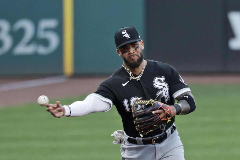 Chicago White Sox's Yoan Moncada throws out Cleveland Indians' Domingo Santana at first base in the first inning in the second baseball game of a doubleheader, Tuesday, July 28, 2020, in Cleveland. (AP Photo/Tony Dejak)