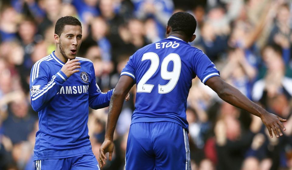 Chelsea's Eden Hazard celebrates with Samuel Eto'o after scoring against Cardiff City during their English Premier League soccer match at Stamford Bridge in London