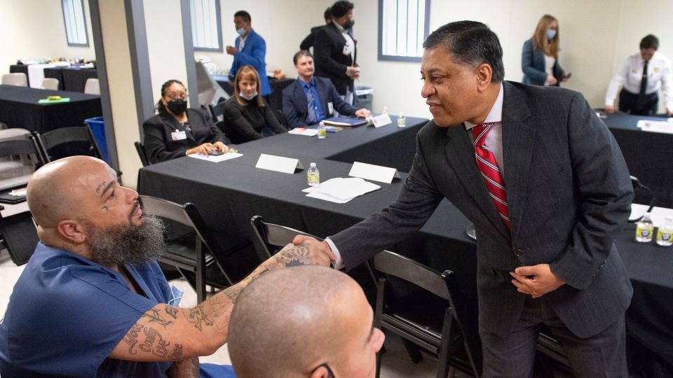 Dr. Rahul Gupta, the drug czar for the Biden Administration, right, speaks with Camden County Correctional Facility resident Freddie Flores as Dr. Gupta visited the Camden jail to discuss the opioid crisis on Tuesday, February 21, 2023.