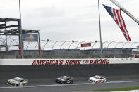 Brennan Poole (15), BJ McLeod (78) and Garrett Smithley (53) drive during the NASCAR Cup Series auto race at Charlotte Motor Speedway Sunday, May 24, 2020, in Concord, N.C. (AP Photo/Gerry Broome)