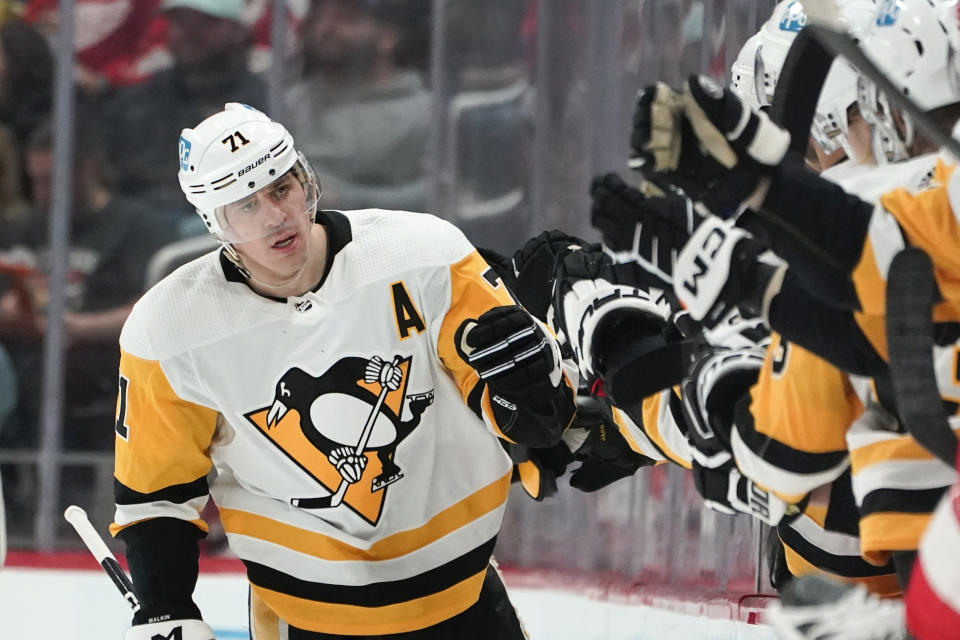 Pittsburgh Penguins center Evgeni Malkin (71) celebrates his goal against the Detroit Red Wings in the second period of an NHL hockey game Tuesday, March 28, 2023, in Detroit. (AP Photo/Paul Sancya)