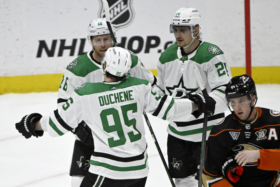 Dallas Stars center Matt Duchene (95) congratulates center Joe Pavelski (16) for a goal against the Anaheim Ducks, as they are joined by Stars' Roope Hintz (24) during the third period of an NHL hockey game in Anaheim, Calif., Friday, March 8, 2024. (AP Photo/Alex Gallardo)