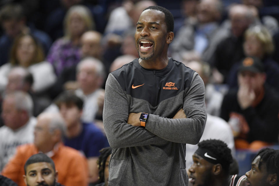 Oklahoma State head coach Mike Boynton reacts in the first half of an NCAA college basketball game against Connecticut, Thursday, Dec. 1, 2022, in Storrs, Conn. (AP Photo/Jessica Hill)