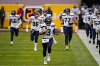 Seattle Seahawks quarterback Russell Wilson (3) runs onto the field before the start of the first half of an NFL football game against the Washington Football Team, Sunday, Dec. 20, 2020, in Landover, Md. (AP Photo/Andrew Harnik)