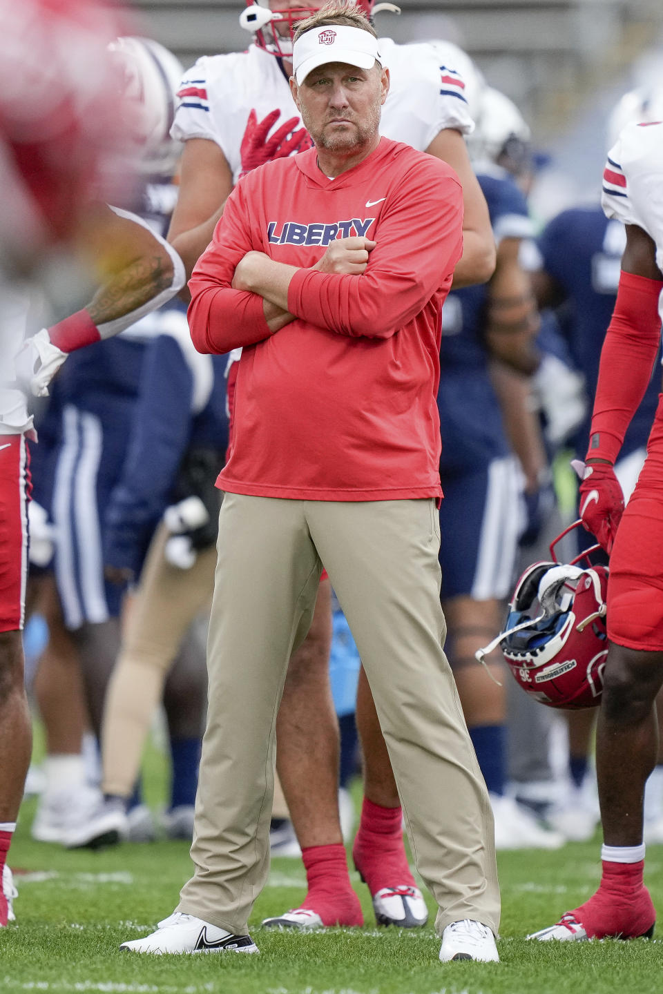 Liberty head coach Hugh Freeze watches as players warm up prior to an NCAA college football game against against the Connecticut in East Hartford, Conn., Saturday, Nov. 12, 2022. (AP Photo / Bryan Woolston)