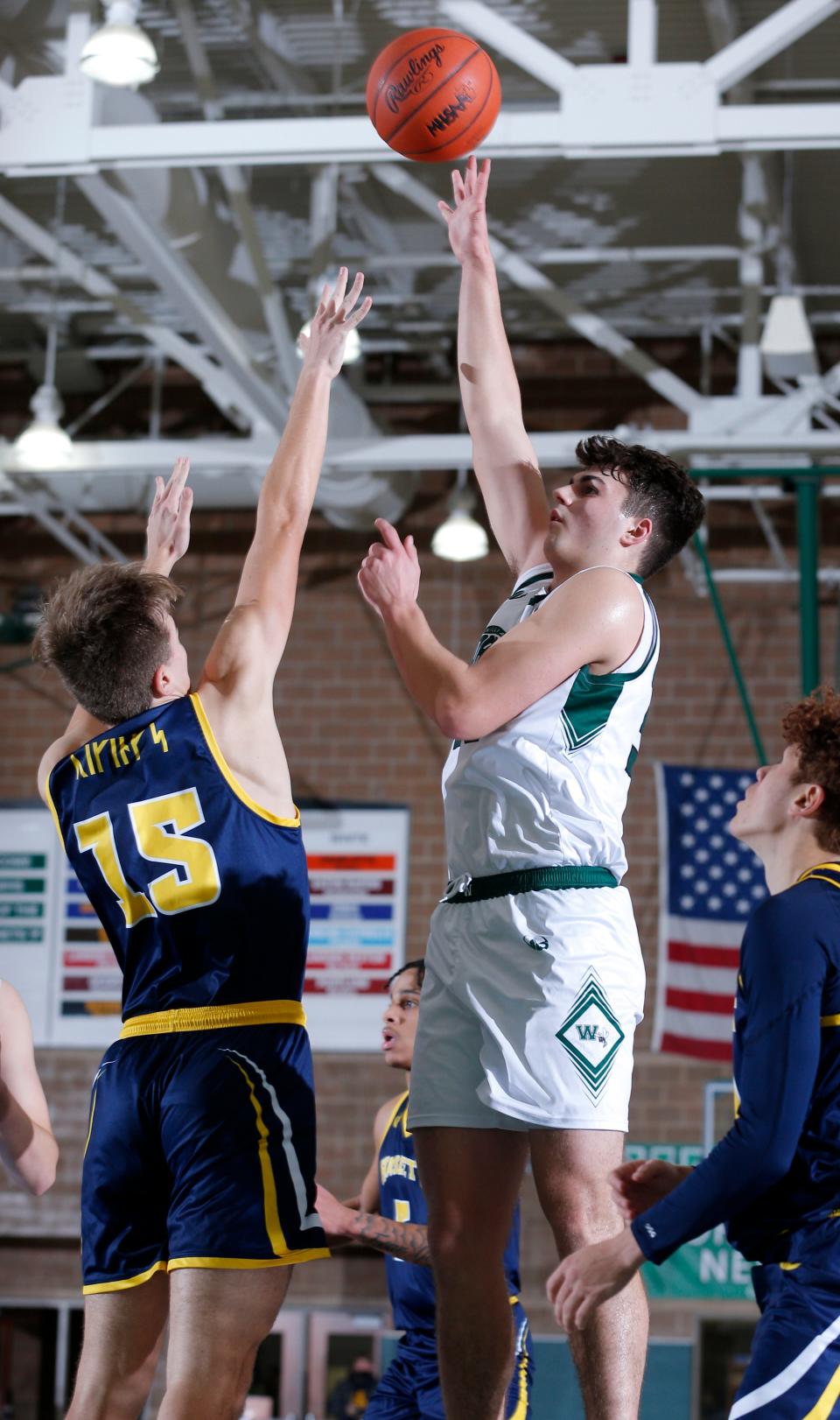 Williamston's Isaac Hahnenberg, right, shoots against Haslett's Erik Lardie (15), Friday, Jan. 7, 2022, in Williamston, Mich. Williamston won 76-35.