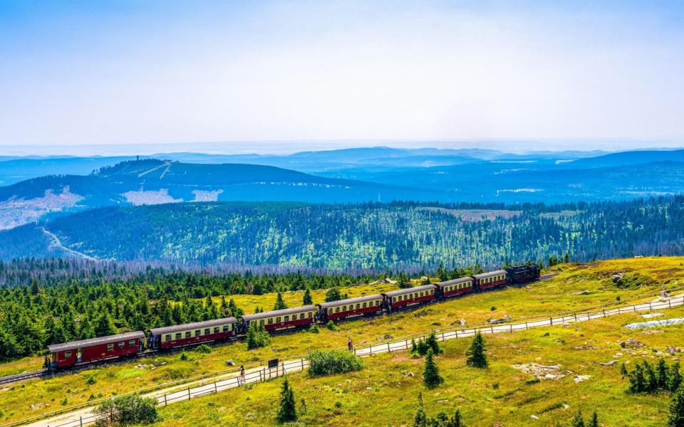 A steam train climbs the Brocken mountain in the Harz national park