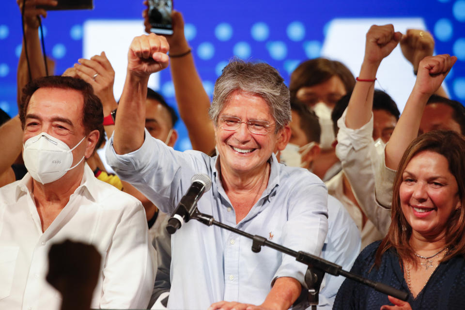 Guillermo Lasso, presidential candidate of Creating Opportunities party, CREO, speaks to supporters after a presidential runoff election at his campaign headquarters in Guayaquil, Ecuador, Sunday, April 11, 2021. With most of the votes counted Lasso, a former banker, had a lead over economist Andres Arauz, a protege of former President Rafael Correa.(AP Photo/Angel Dejesus)