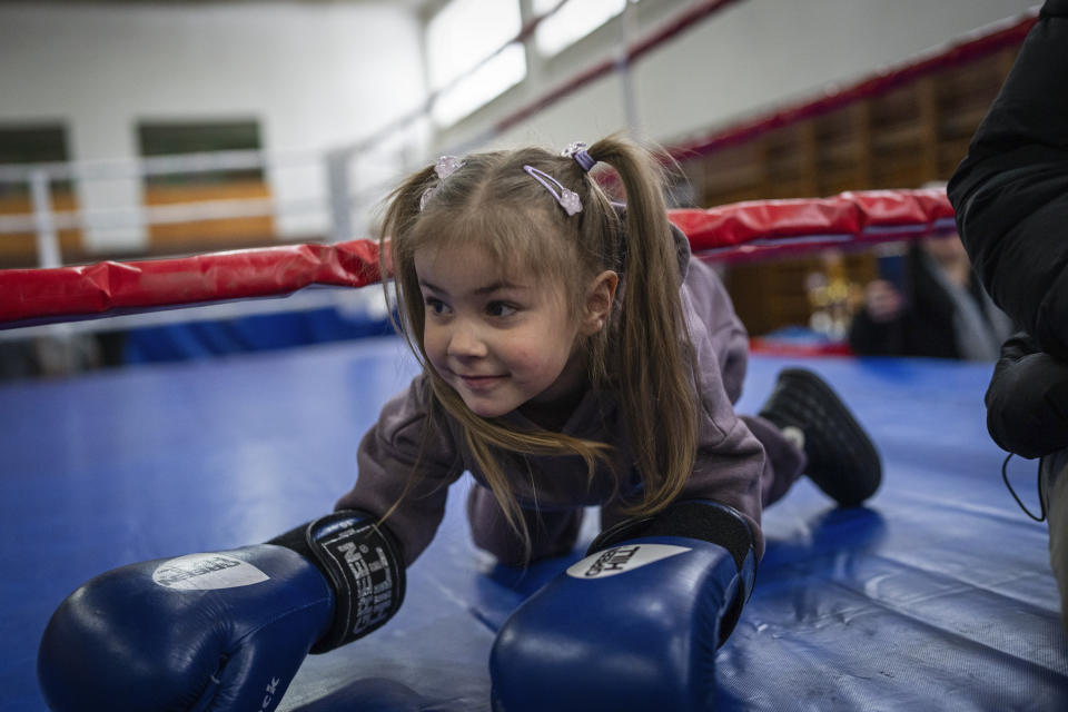 Vasilisa plays during a boxing tournament in honor of her father Maksym Halinichev, who was killed during fighting with Russian forces in March 2023, in Romny, Sumy region, Ukraine on Saturday, Feb. 3, 2024. (AP Photo/Evgeniy Maloletka)