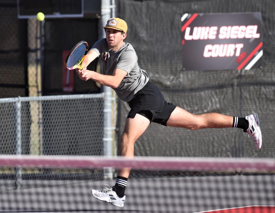 Wylie's Grant Bristow track down a shot against Amarillo High's Kelton Brown and Wade Bryan. The Amarillo High team beat Bristow and Connor Brown 6-2 7-5 in the boys doubles finals at the Region I-5A tournament April 11 at Texas Tech's McLeod Tennis Center.