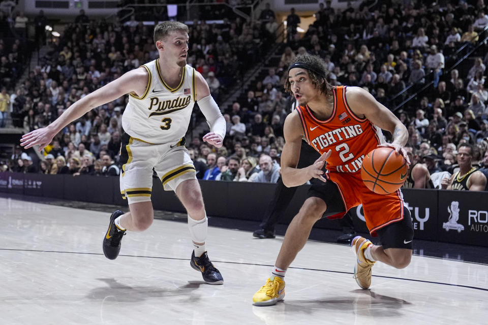Illinois guard Dra Gibbs-Lawhorn (2) drives on Purdue guard Braden Smith (3) during the first half of an NCAA college basketball game in West Lafayette, Ind., Friday, Jan. 5, 2024. (AP Photo/Michael Conroy)