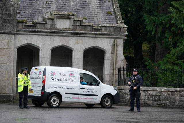 A florist van from the firm The Secret Garden arrives at the gates of Balmoral