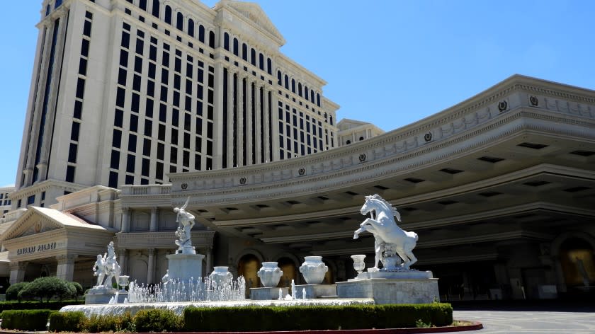 The main entrance to Caesars Palace in Las Vegas, devoid of the usual taxis and other vehicles, is seen May 16 during the state-ordered shutdown of Nevada. Traffic is expected to resume, at least to some degree, when the resort reopens on June 4.