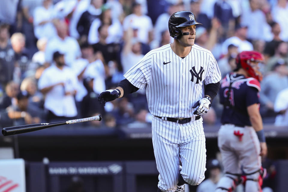 New York Yankees' Anthony Rizzo drops the bat after hitting a home run as Boston Red Sox catcher Reese McGuire watches during the seventh inning of a baseball game Saturday, Sept. 24, 2022, in New York. (AP Photo/Jessie Alcheh)