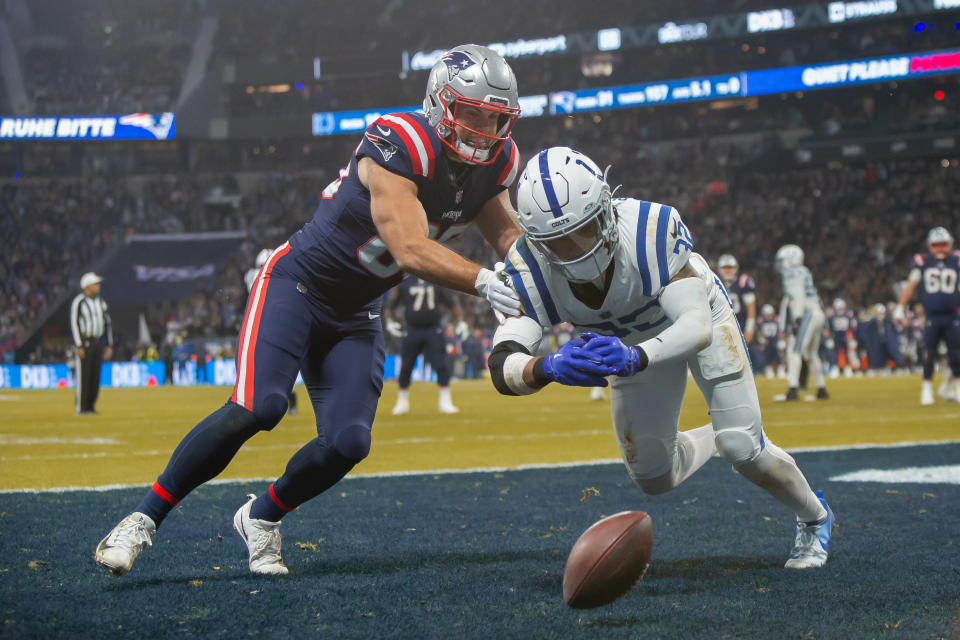 FRANKFURT AM MAIN, GERMANY - NOVEMBER 12: Hunter Henry of New England Patriots and Julian Blackmon of Indianapolis Colts battle for the ball during the NFL match between Indianapolis Colts and New England Patriots at Deutsche Bank Park on November 12, 2023 in Frankfurt am Main, Germany. (Photo by Mario Hommes/DeFodi Images via Getty Images)