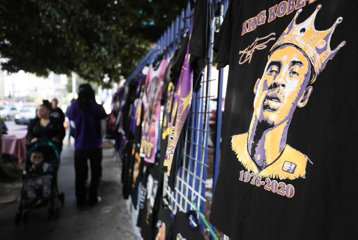 Memorabilia is sold outside the "Celebration of Life for Kobe and Gianna Bryant" on Monday at Staples Center in Los Angeles. Retired NBA star Kobe Bryant, 41, and his 13-year-old daughter, Gianna, were killed along with seven others in a helicopter crash near Los Angeles on Jan. 26. (Photo: Mario Tama via Getty Images)