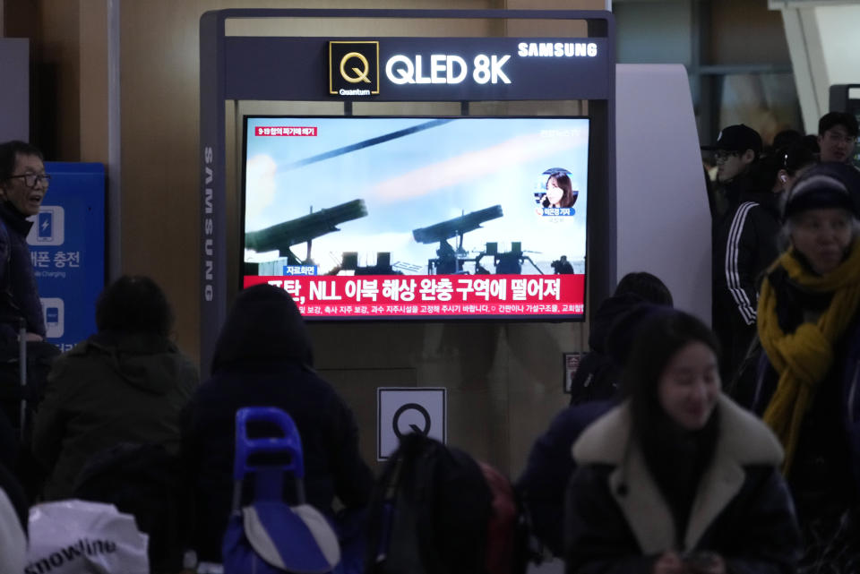 A TV screen shows a file image of North Korea's military exercise during a news program at the Seoul Railway Station in Seoul, South Korea, Saturday, Jan. 6, 2024. North Korea conducted a new round of artillery drills near the disputed sea boundary with South Korea on Saturday, officials in Seoul said, a day after the North's earlier exercises prompted South Korea to respond with its own drills in the same area. (AP Photo/Ahn Young-joon)