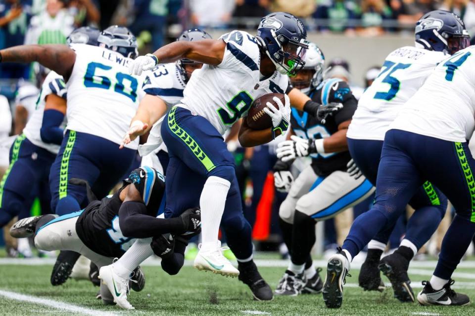 Seattle Seahawks running back Kenneth Walker III (9) rushes against the Carolina Panthers during the first quarter at Lumen Field.