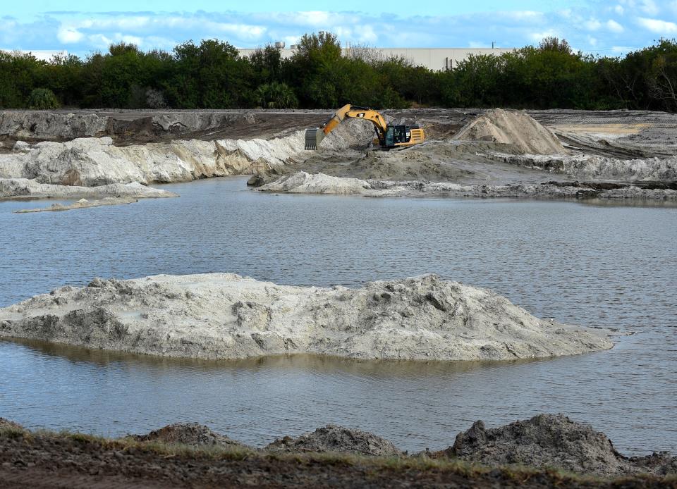 A lone excavator operator is working on the grounds for the new 1.1 million-square-foot Amazon fulfillment center project, as seen from the southbound interstate 95 south of the Midway Road exit on Wednesday, Jan. 19, 2022, in St. Lucie County. The project is scheduled to be completed by late summer or early autumn of 2022.