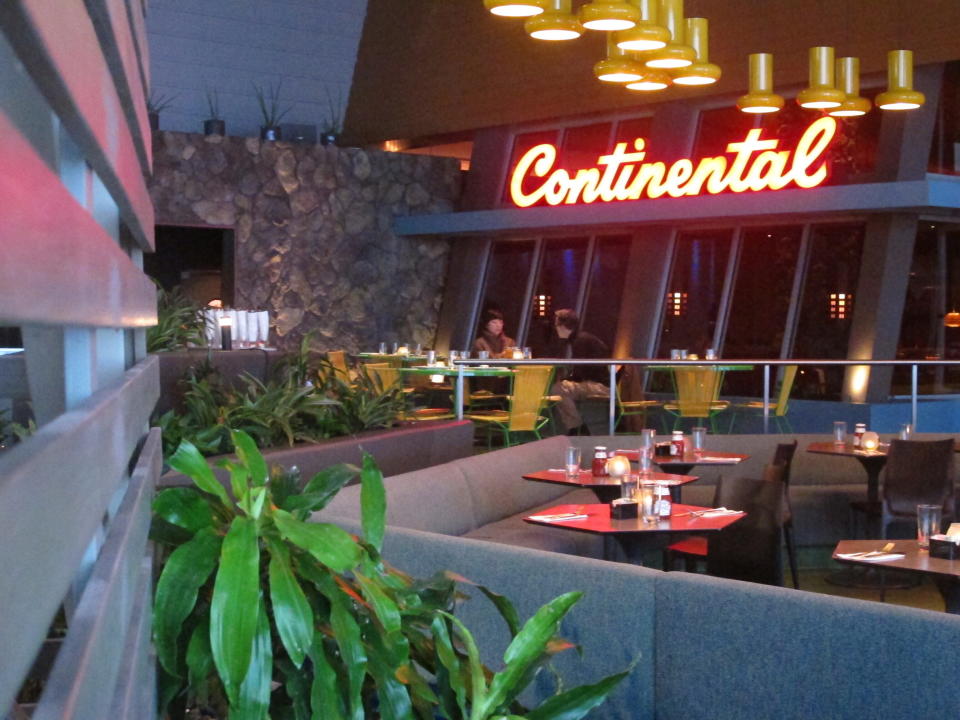 Two people eat in an otherwise empty Continental restaurant in Atlantic City, N.J. on Jan. 23, 2020. Philadelphia restaurant owner Stephen Starr told The Associated Press on Oct. 6, 2020 that the Continental and Buddakan, two eateries he owns in the former Playground Pier, will not reopen, due largely to restrictions made necessary by the coronavirus outbreak and their impact on foot traffic in the area. (AP Photo/Wayne Parry)