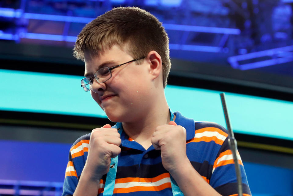 <p>Joel Miles, 14, from Greenwood, Mo., reacts after spelling his word correctly in the third round of the 90th Scripps National Spelling Bee, Wednesday, May 31, 2017, in Oxon Hill, Md. (AP Photo/Alex Brandon) </p>