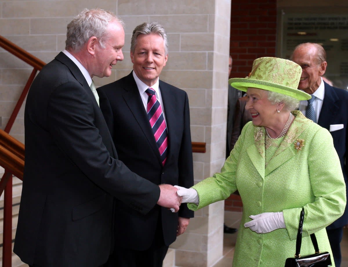 Paul Faith’s historic photograph of the Queen shaking hands with Northern Ireland’s then deputy First Minister Martin McGuinness in 2012 (Paul Faith/PA) (PA Archive)