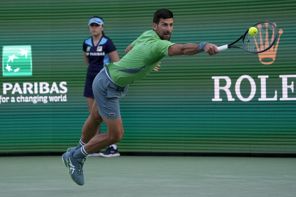 Novak Djokovic, of Serbia, returns to Aleksandar Vukic, of Australia, at the BNP Paribas Open tennis tournament, Saturday, March 9, 2024, in Indian Wells, Calif. (AP Photo/Mark J. Terrill)